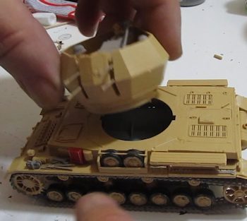 The turret attaches to the tank