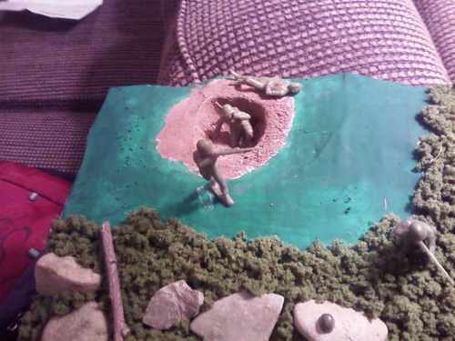 Foxhole and water in the diorama