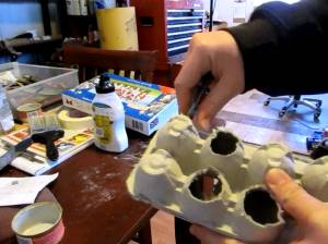 Cutting an egg carton for the mask gear
