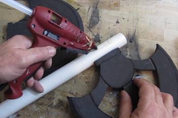 Glue axe heads onto PVC handle