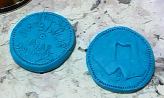 The two coin halves closeup