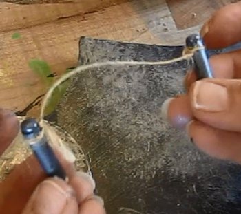 Tie a string from pin to pin