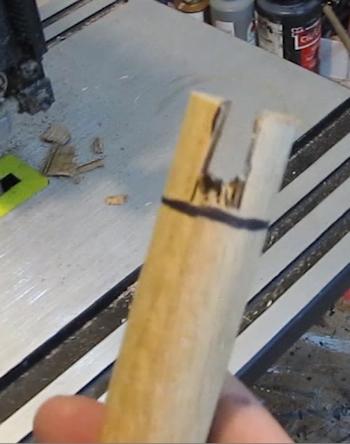 Cut a slot in the wooden dowel