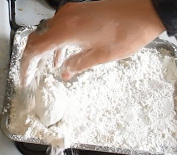 Cover the pipe in flour