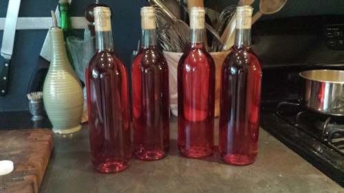Four bottles of berry mead