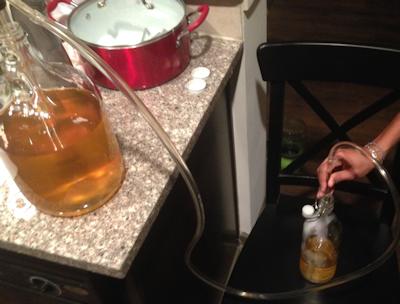 Racking mead with a siphon
