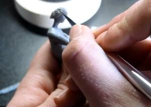 Sculpting the detail in the hair of the miniature
