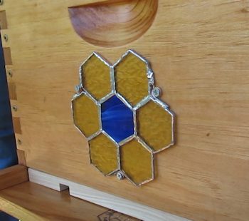 Stained glass ornament on the beehive