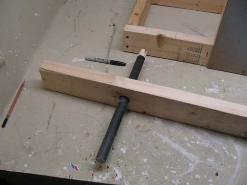 Drill the swing arm so the dowel fits easily