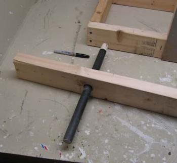 Drill the swing arm so the dowel fits easily