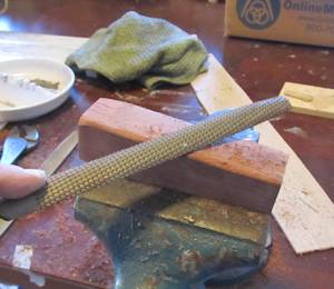 Rasp the shape of the handle