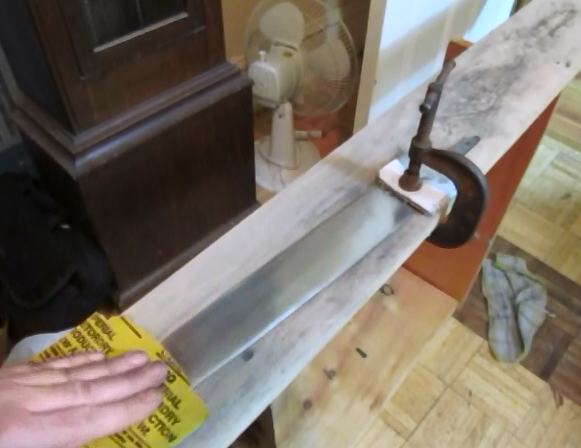 Polishing the blade of the sword