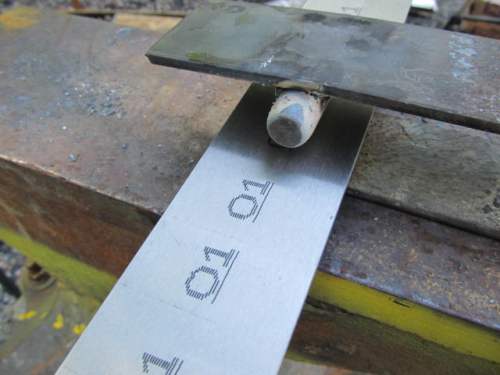 Fullering a piece of steel