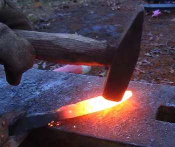 Hammer the heated steel