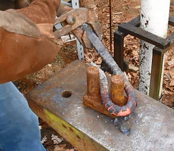 https://www.stormthecastle.com/blacksmithing/images/rebar-knife/using-the-turning-tool.jpg