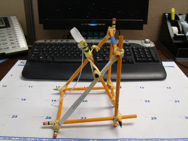 A catapult made out of office supplies
