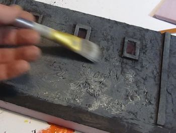 Lightly dry brush the wall