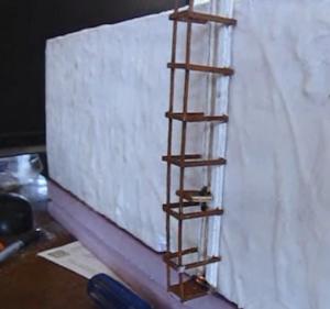 The elevator is mounted to the wall