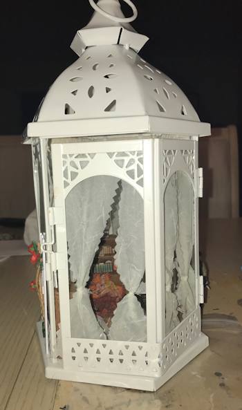 Homecoming diorama in a lantern