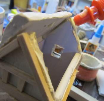 Applying glue to tops of buildings