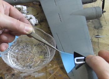 Slide decal onto aircraft