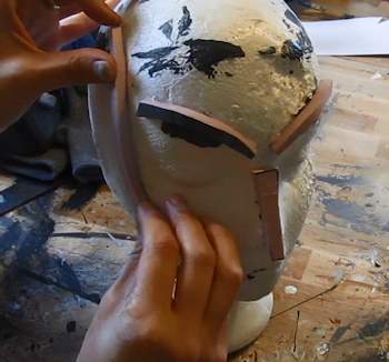 Glue pieces to mannequin head