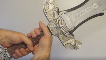 Grasp the handle with two hands