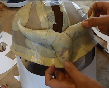 Glue dragon ornament onto helmet