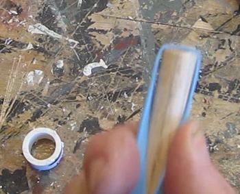 Rubber band on dowel