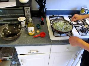 Combining and stiring the dry ingredients into the pan