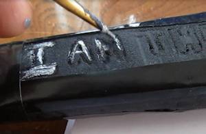 Add detail to accent the inscription