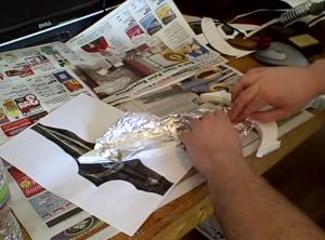 Creating the rough metal effect with some aluminum foil in the center of the blade.