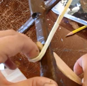 Cock the  rubber band
