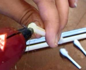 Glue other end of straw