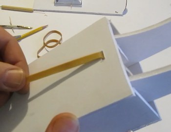 Pull and adjust the rubber band