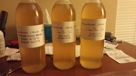 Three bottles of orange clove mead