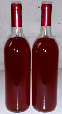 Two bottles of mead with shrink caps