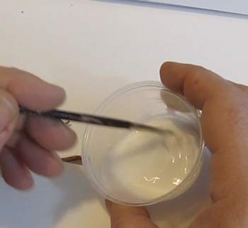 Mix white glue and water