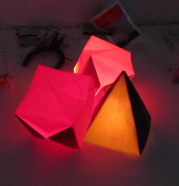 Three origami objects lit up