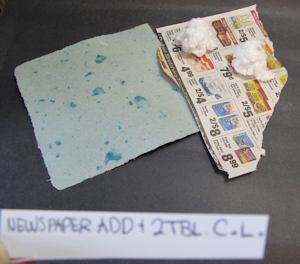 Newspaper advertisement and cotton linters