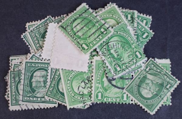 A group of one cent green franklin stamps